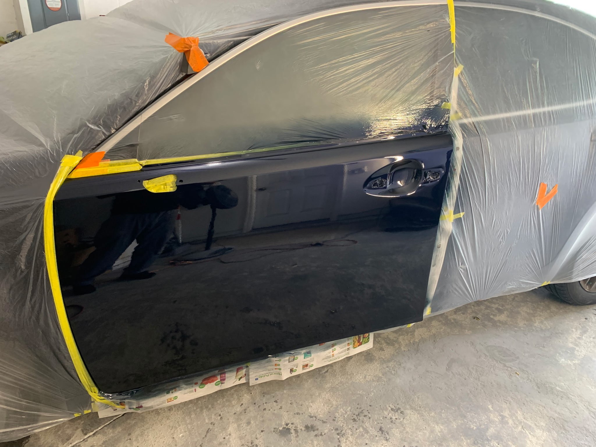 Blue car door after dent repair in DeBary FL