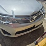 Toyota front bumper dent repair before