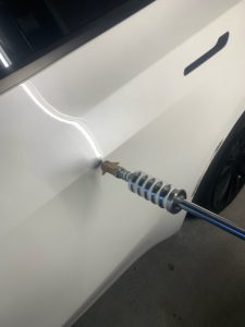 tesla suv dent repair before